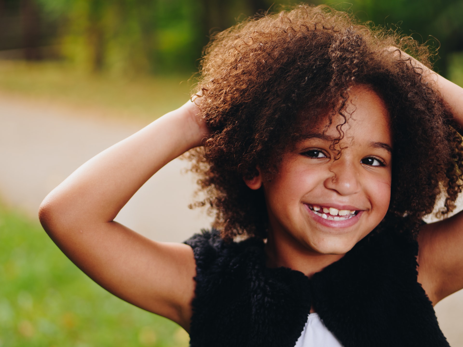 Kids smiling after fluoride treatments in Naples, FL