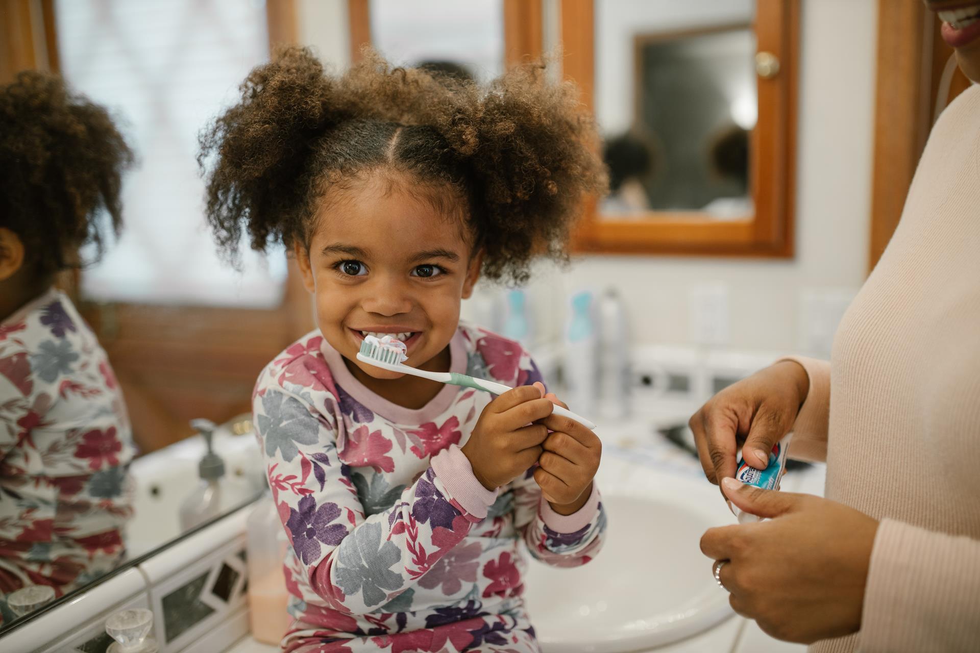 Kids learning how to brush properly at a Naples, FL pediatric dental office